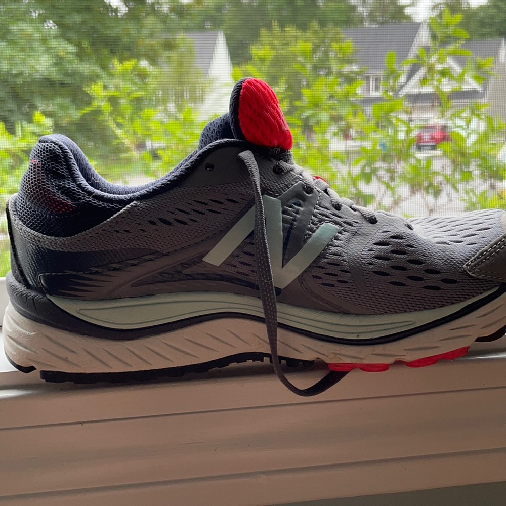 Grey New Balance sneakers.